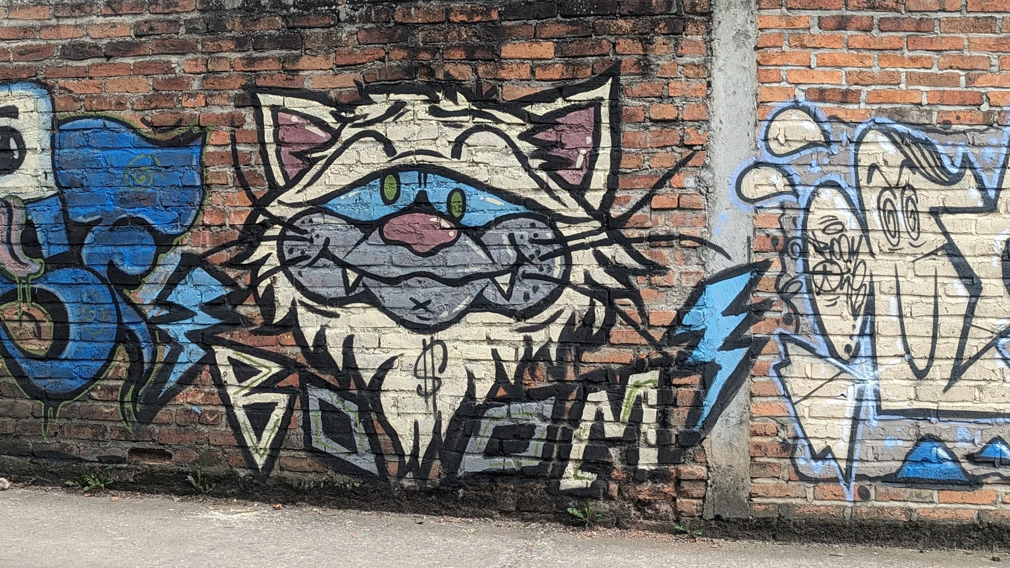 A geometric fish on brick