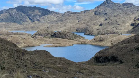 Blue water among rocky hills