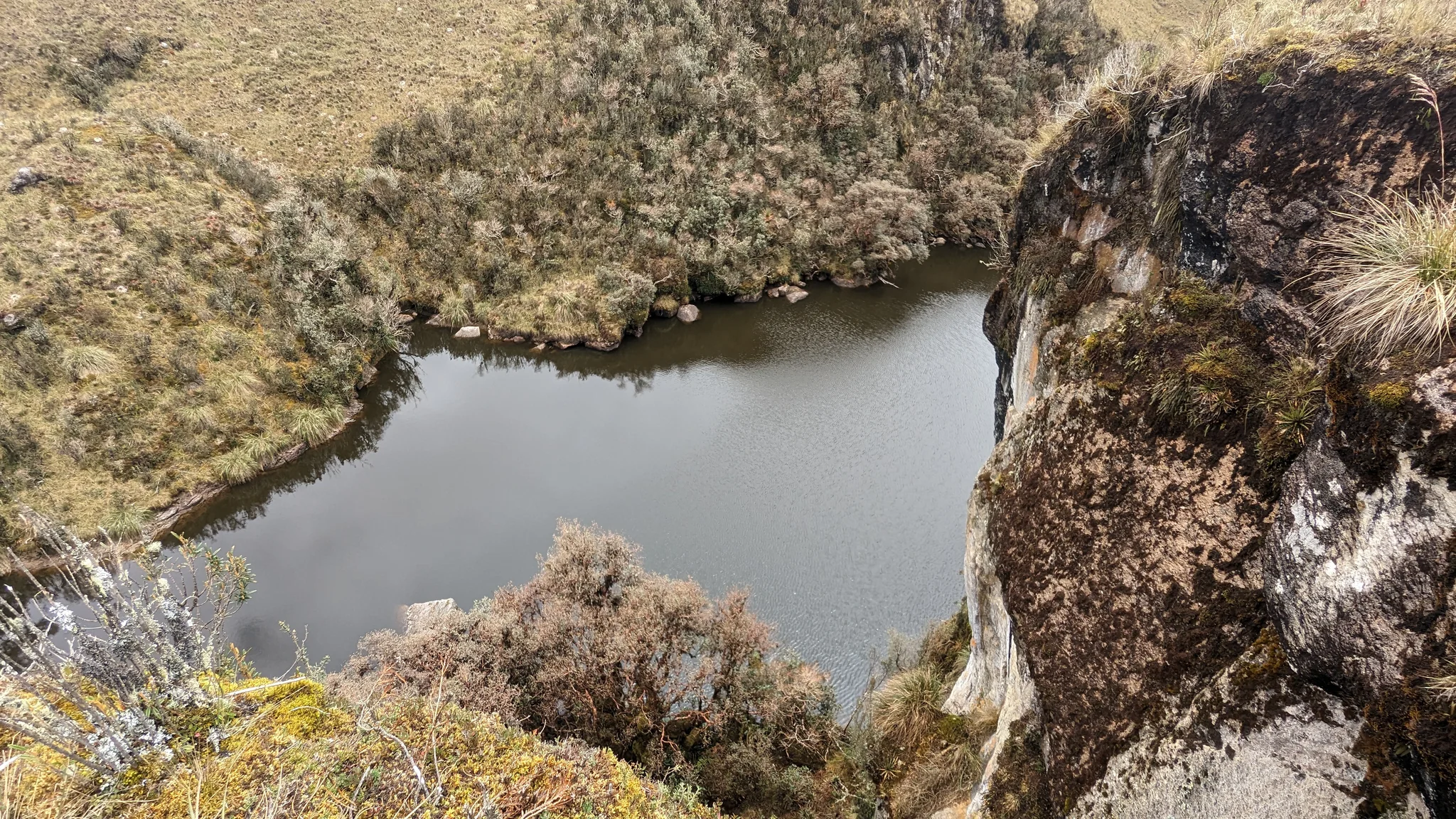 Laguna Pizarro beyond the rocky edge.