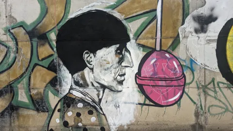 A portrait with a pink circle