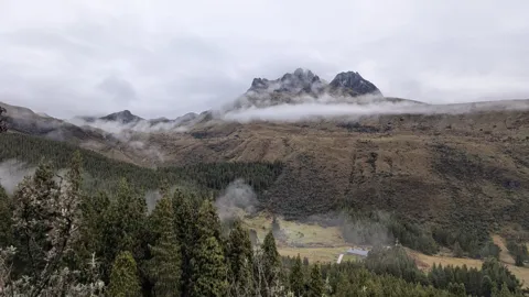 Clouds around a rugged mountain
