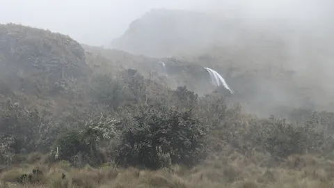 A distant waterfall through the mist