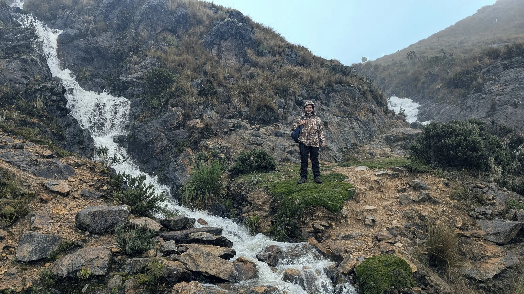 Pausing beside a mountain cascade