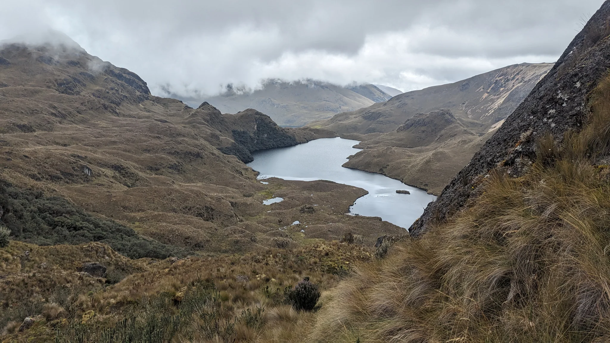 Water at the foot of a green valley