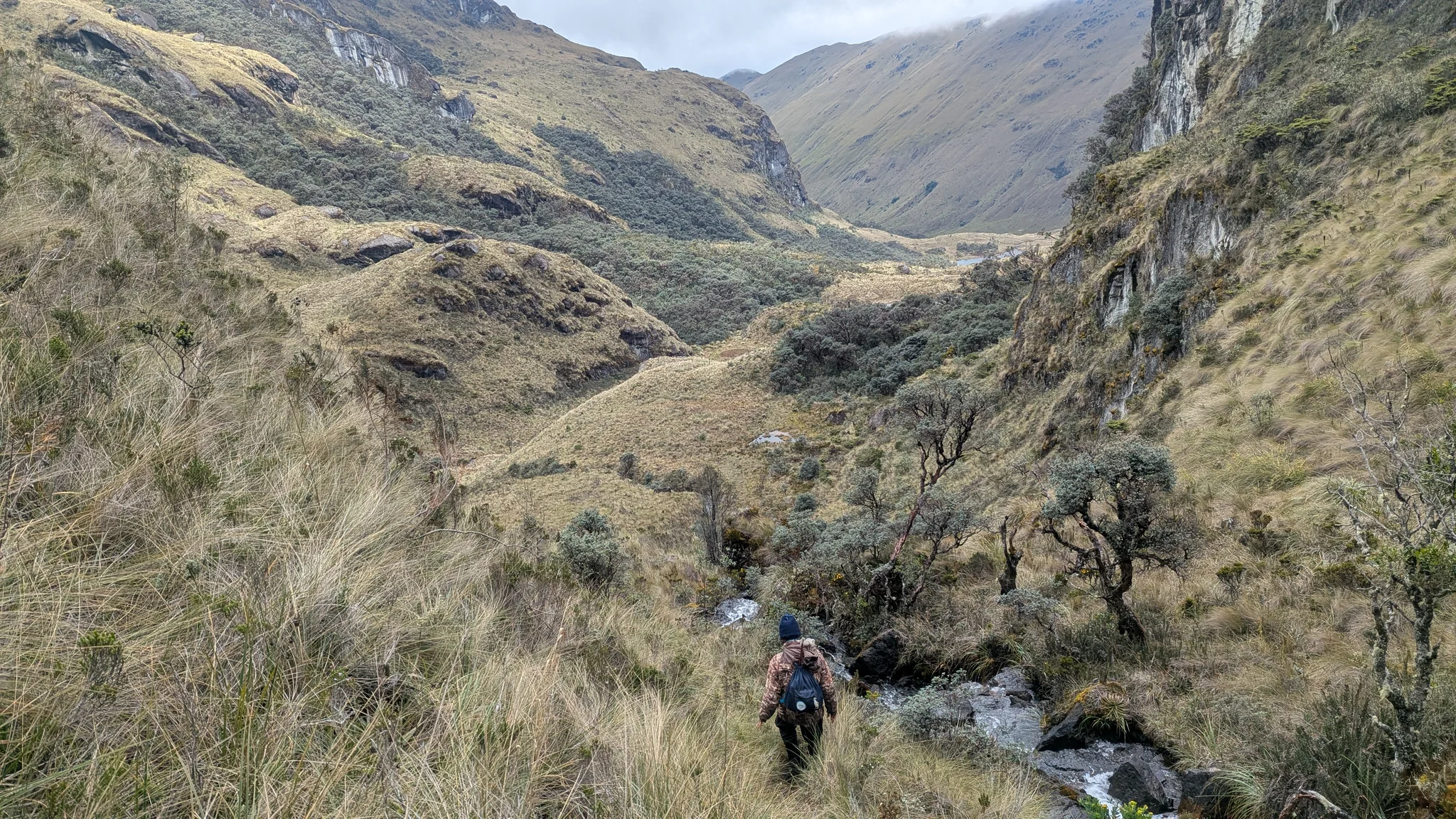 A winding valley between steep slopes
