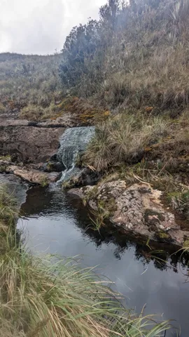 Narrow lake through a rocky valley. The water body is not securely named.