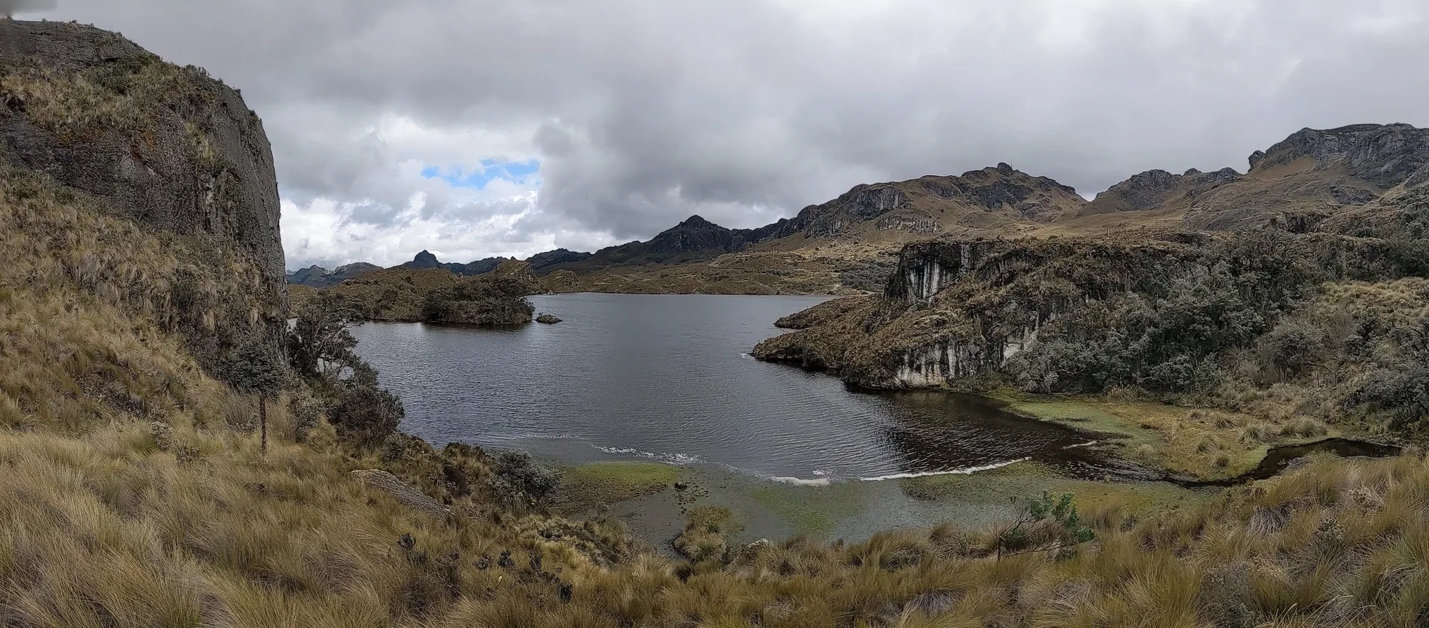 A highland lake between grassy shores. The water body is not securely named.