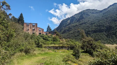 Lakeside house and mountain.