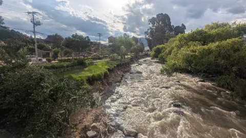 Rushing water among rounded boulders
