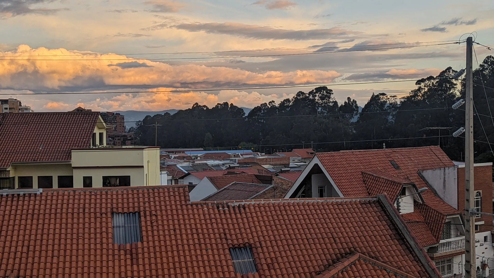 Red-tiled roofs beneath an evening sky