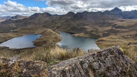 Lagoons below rugged peaks.