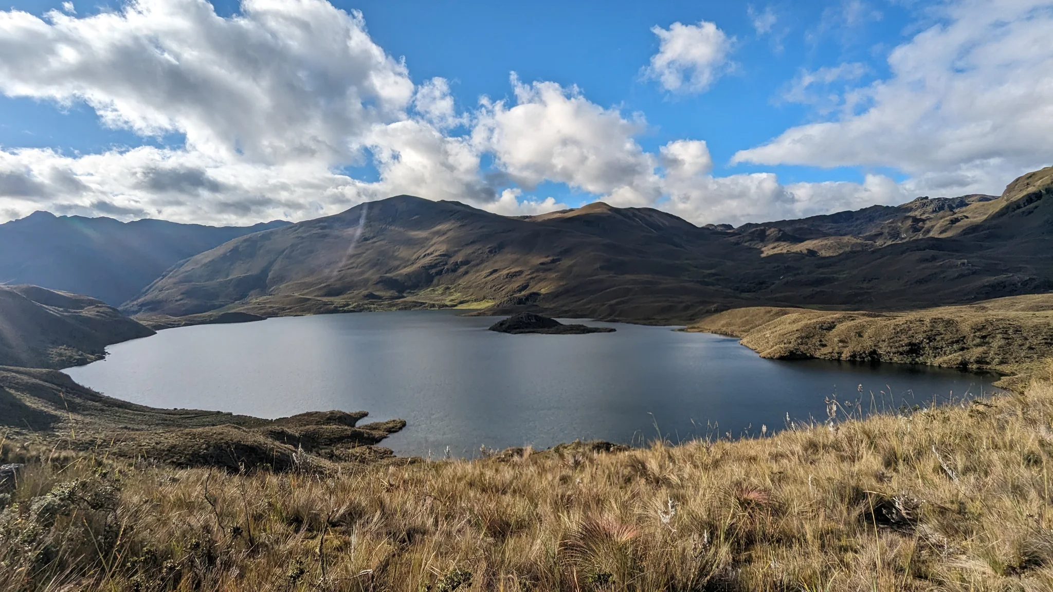 Clouds over mountain lake.