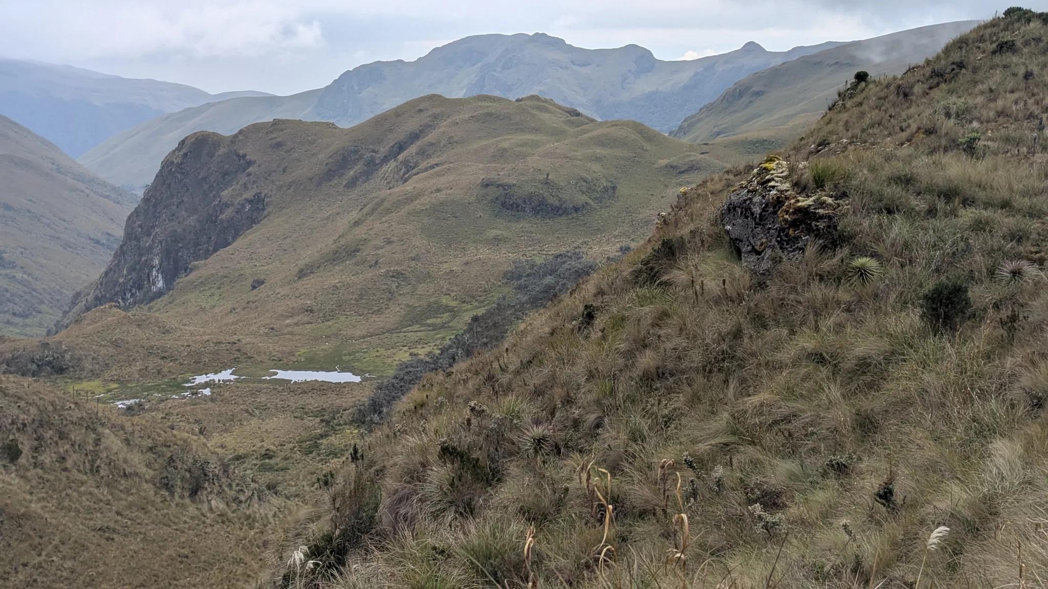 Mountain ridge and small lake. The water body is not securely named.