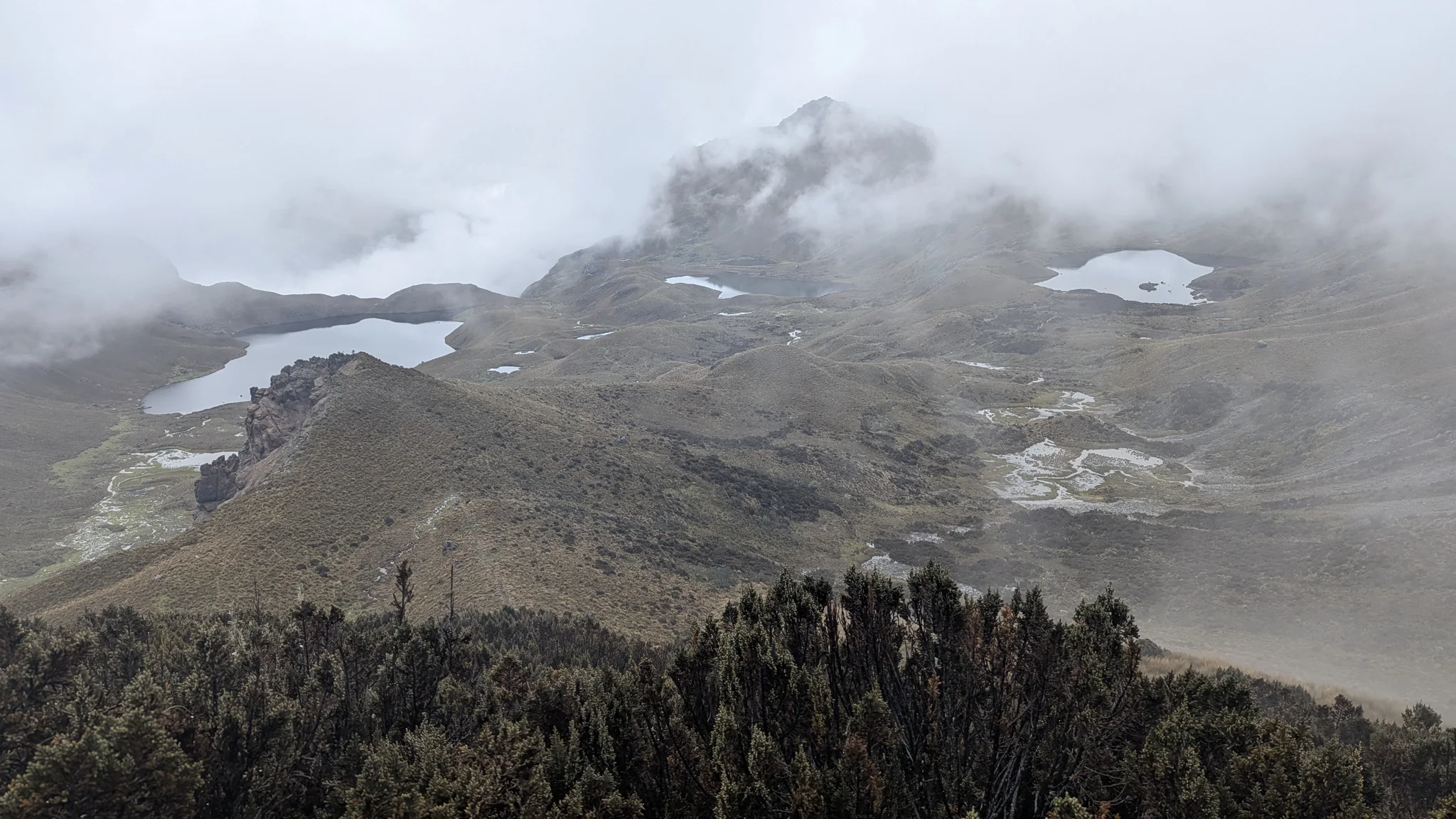 Low fog drifts across a highland basin dotted with lakes during the Chuzalongo outing. Individual lakes are left unnamed.