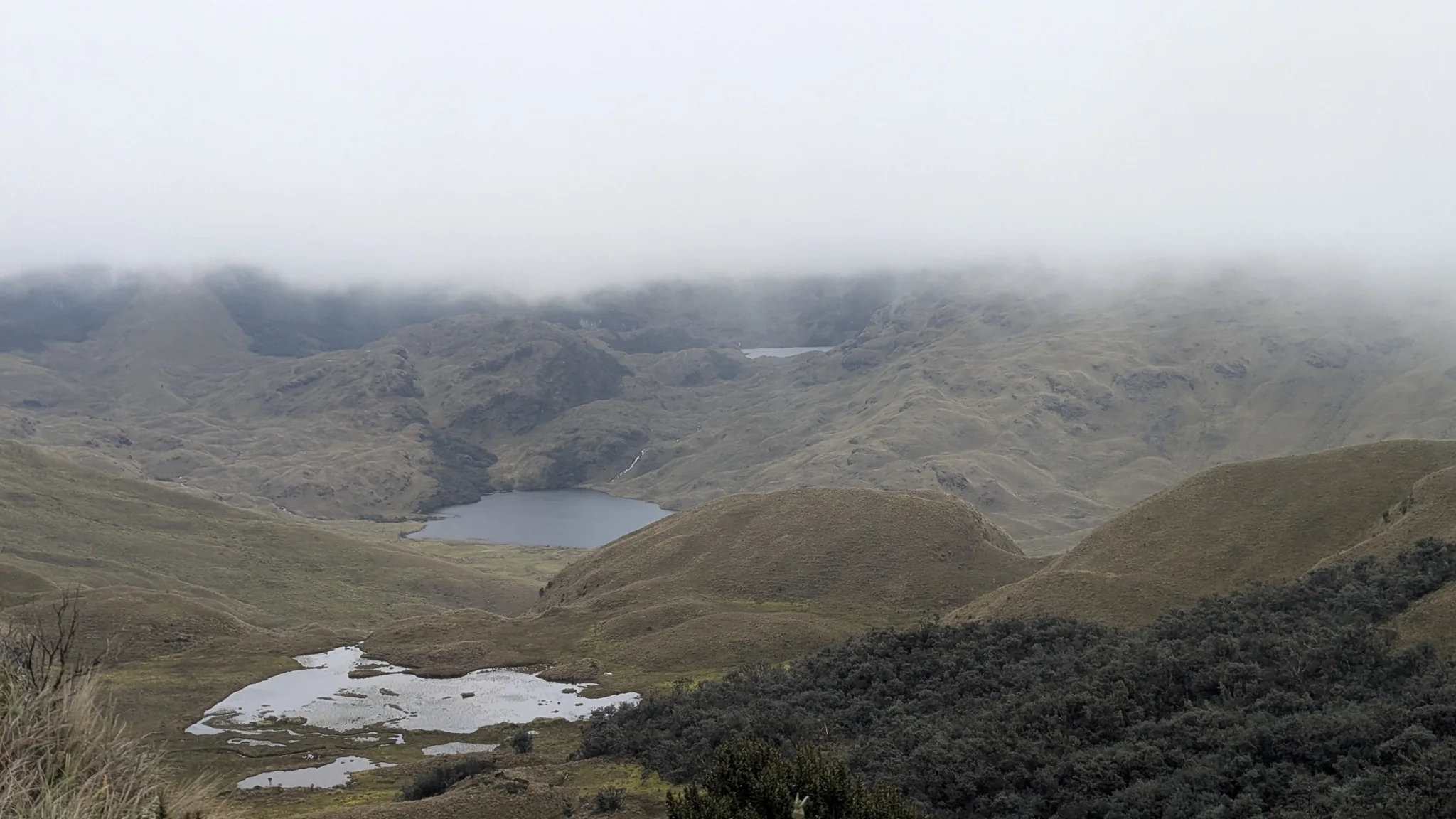 Misty highland lake basin.