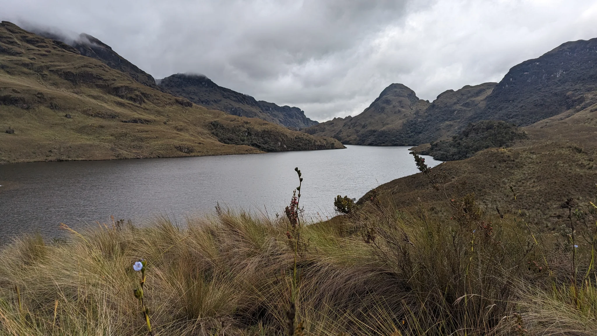 Highland lake below dark ridges.