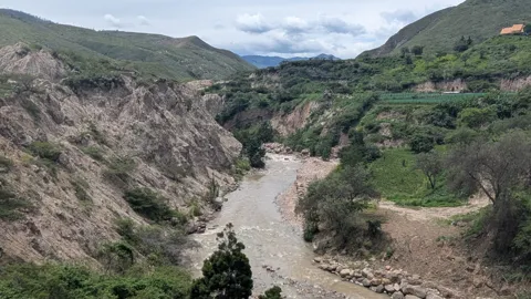 A river winding through a steep valley