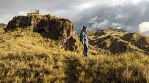 Walking between rocky outcrops