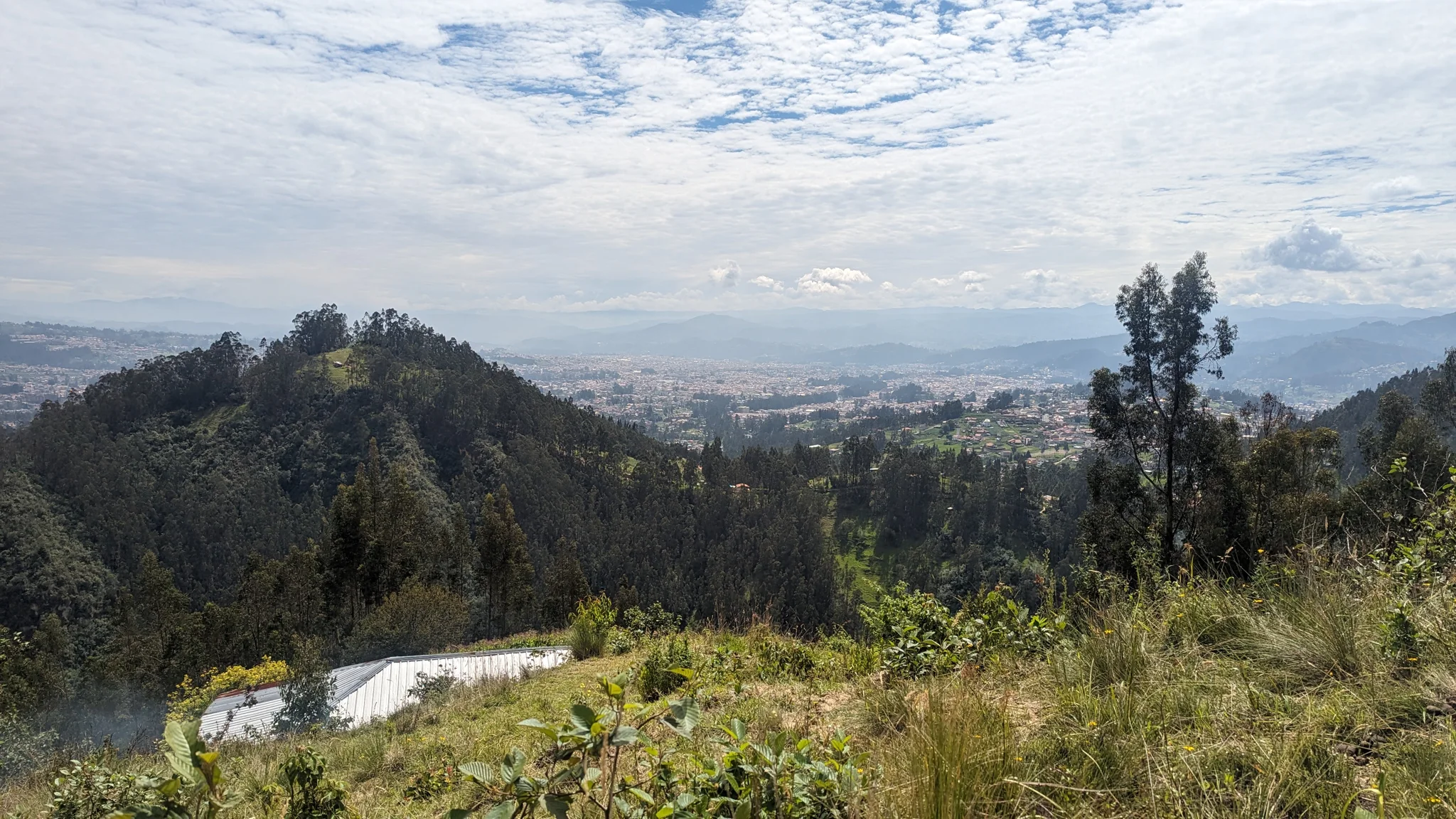 Distant reservoir or lake below a mountain ridge. The water body is not securely named.