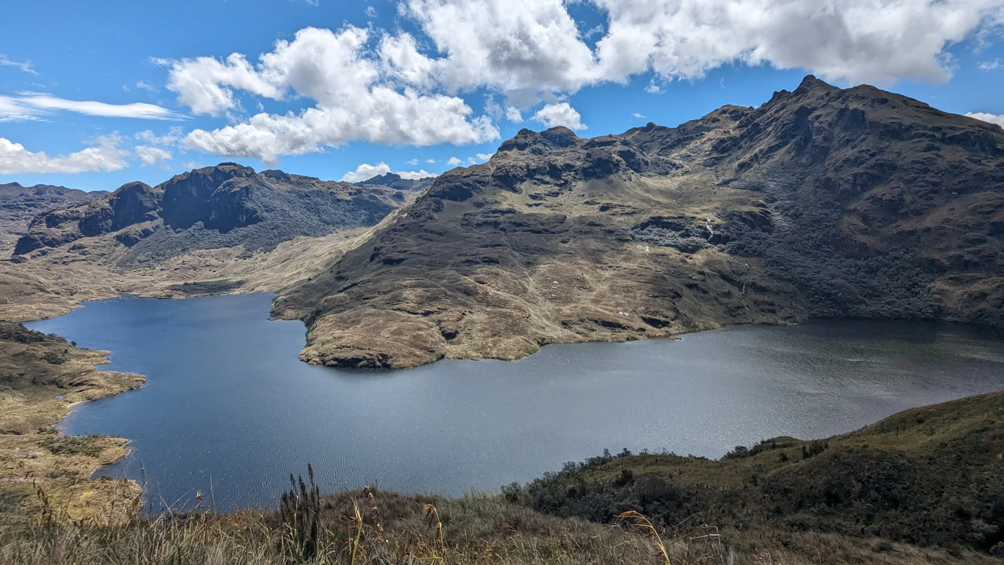 Large lake below jagged peaks.