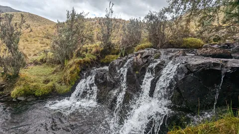 A broad cascade over dark rock