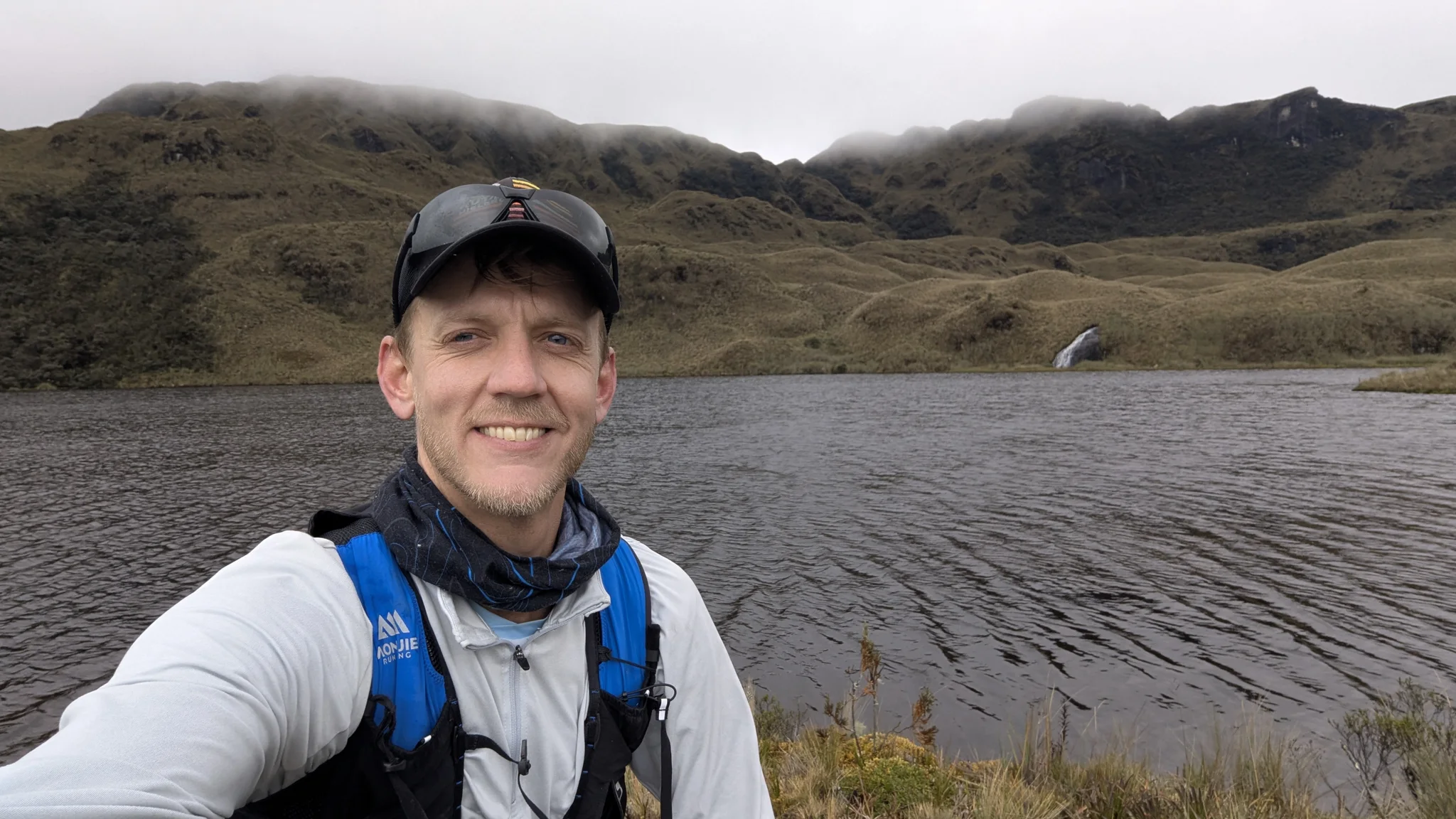 Runner selfie by a dark lake.
