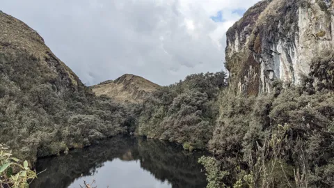 Mountain lake below cliffs. The water body is not securely named.