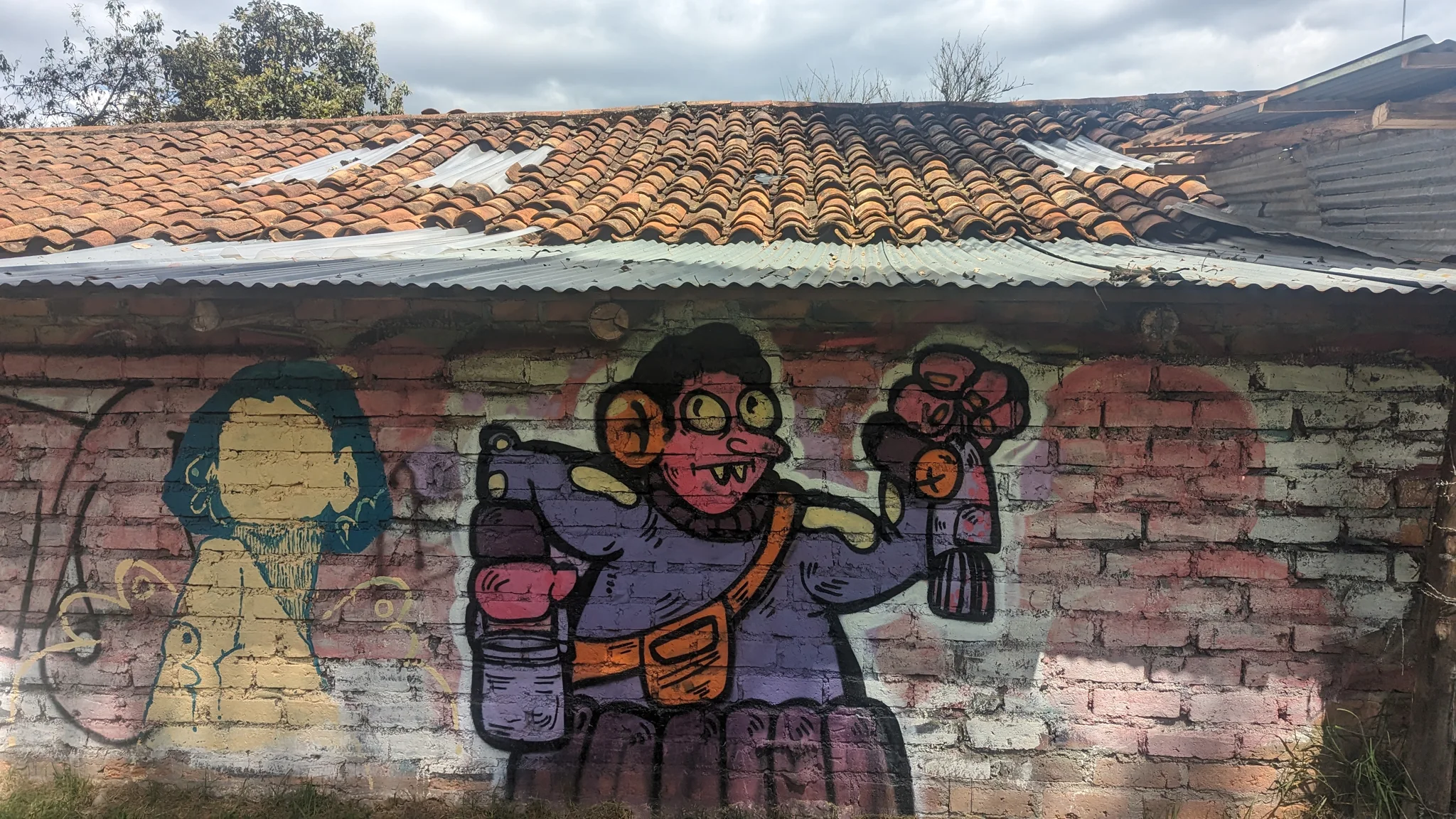 Painted figures on a brick wall