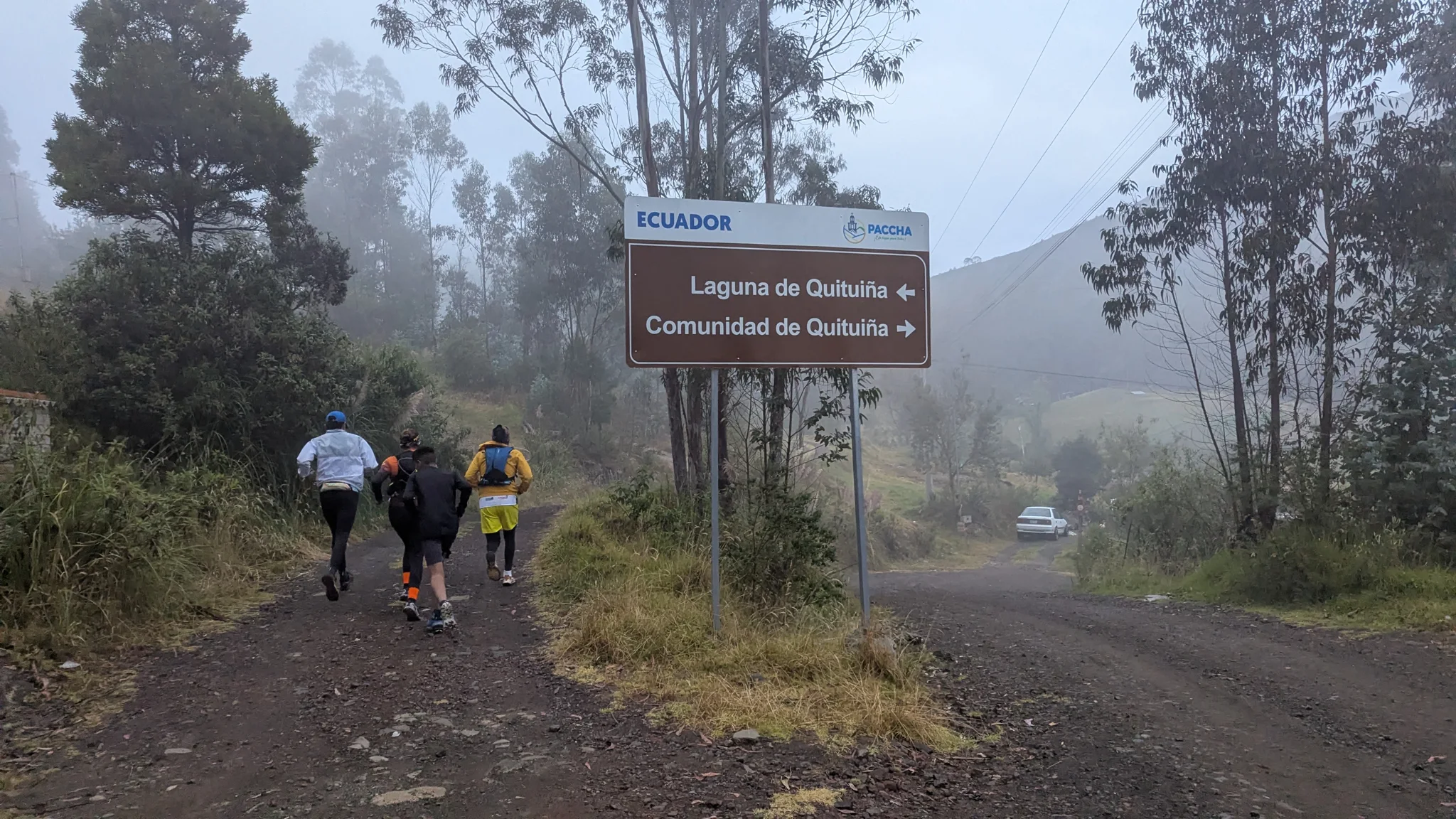 A trail sign in the mist