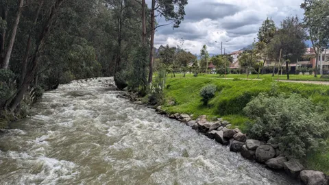 Fast water beside the riverside path